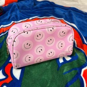 Smiley face makeup bag